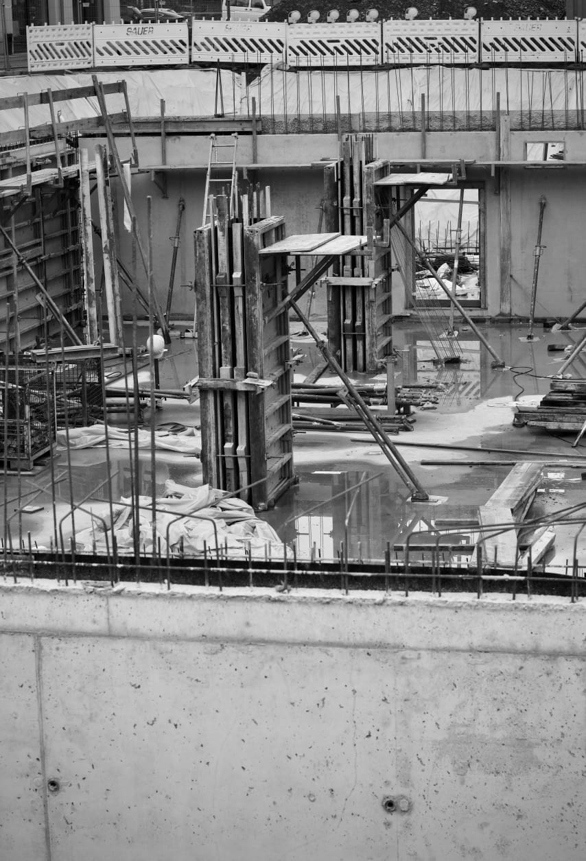 Column formwork and reinforcement bars on a concrete floor slab